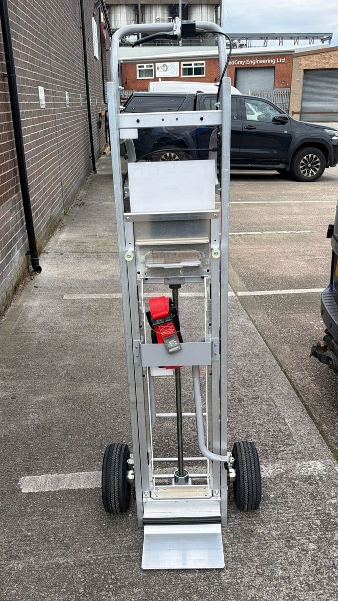 The Powerwall dolly, showing the lifting frame, lead screw, ratchet strap and pneumatic tyres